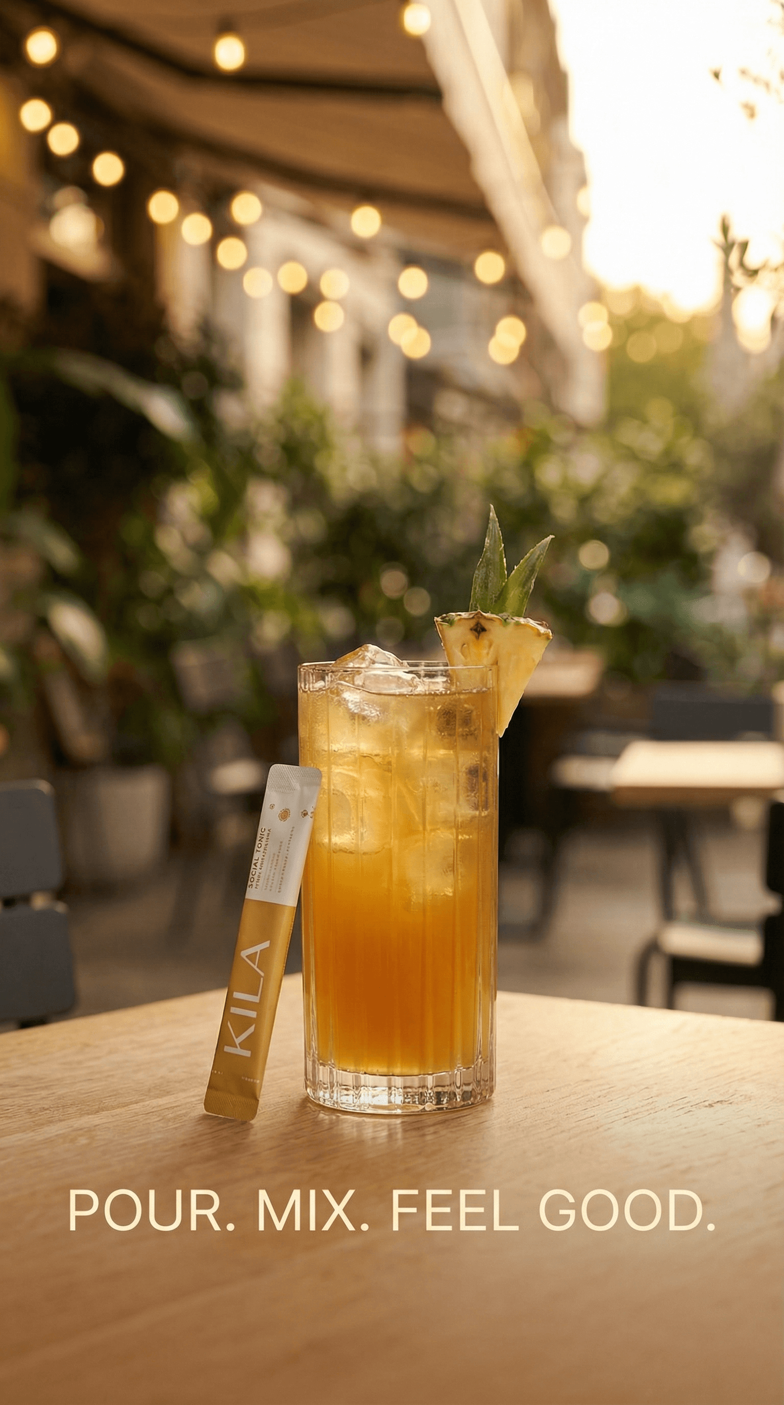 Pineapple KILA Social Tonic garnished on a café patio table at golden hour